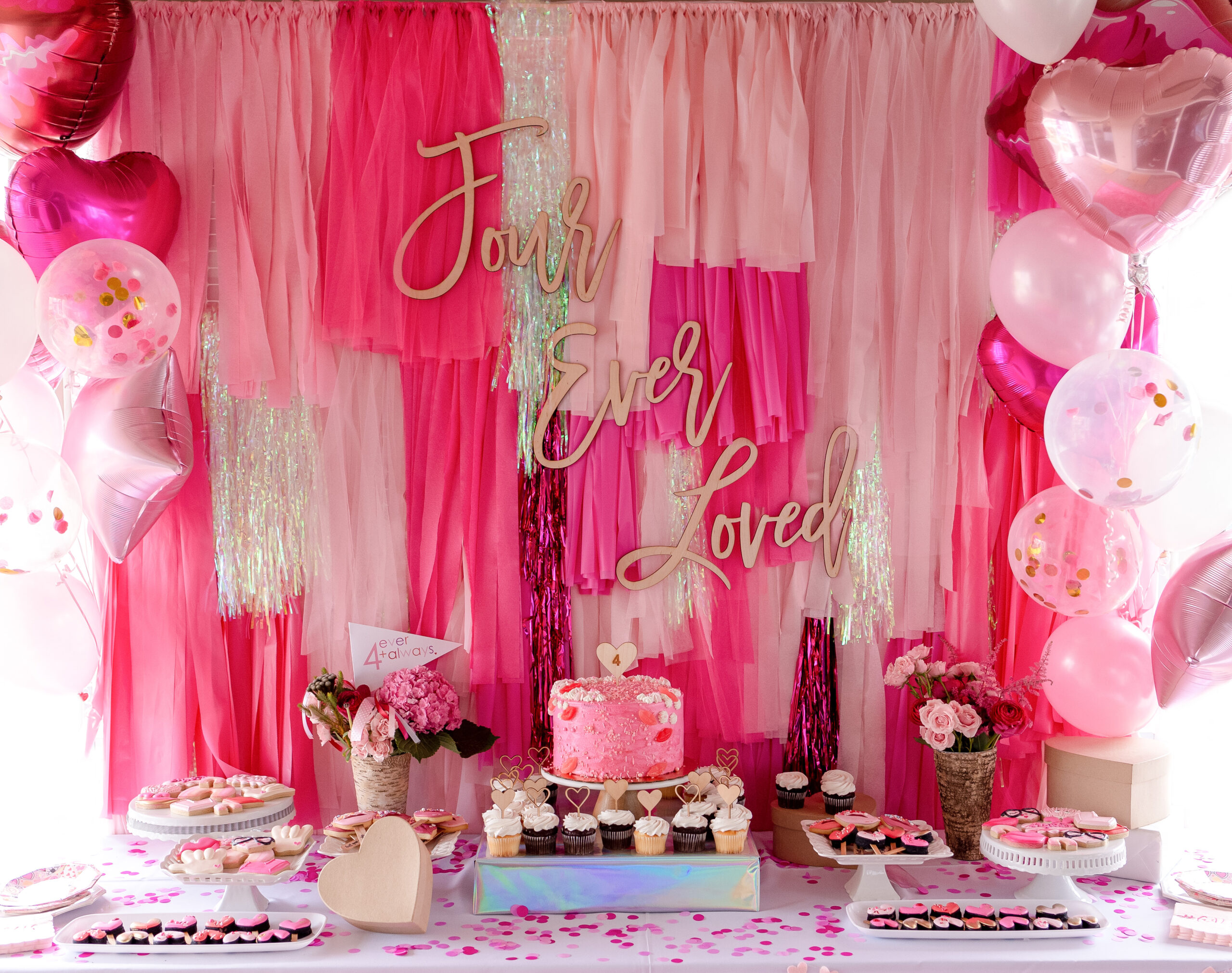 Bright pink fringe backdrop for Dessert table. 