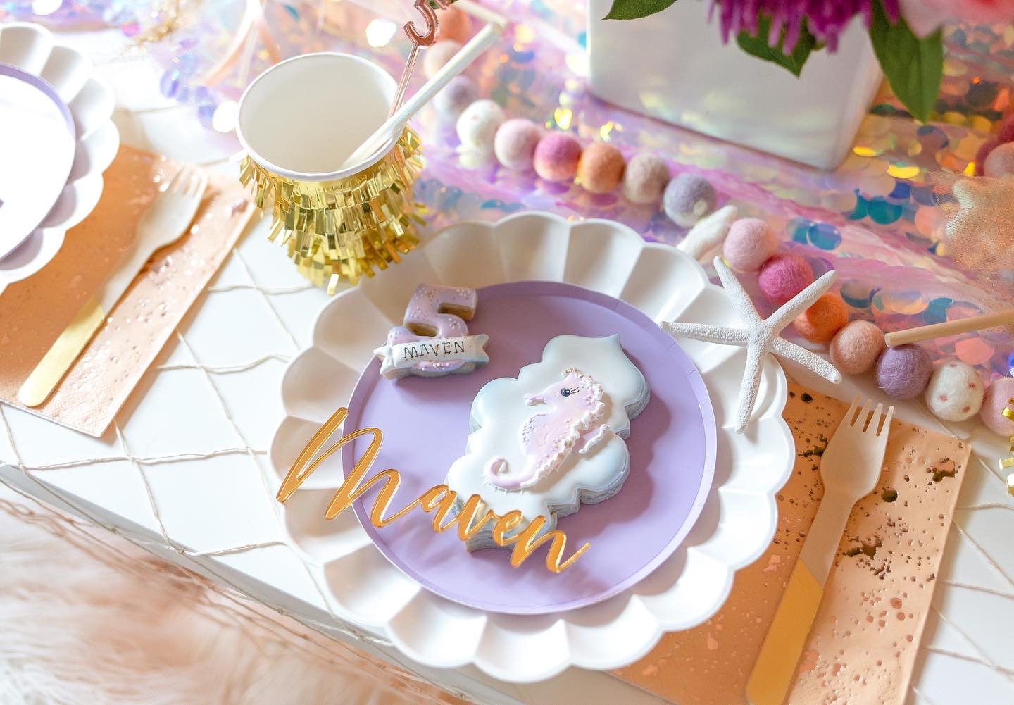 Seahorse cookie on purple plate for little girls 5th birthday